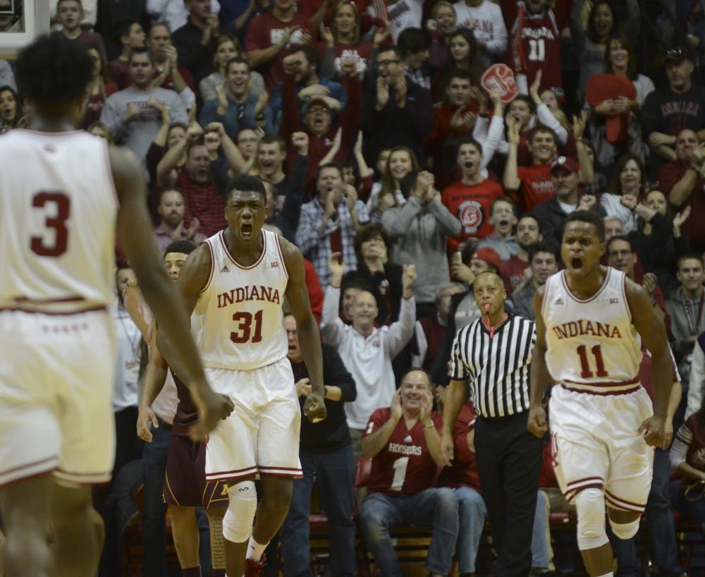 Freshman center Thomas Bryant (31) and senior guard Kevin "Yogi" Ferrell (0) celebrate during the game against Minnesota on Saturday at Assembly Hall. The Hoosiers won 74-48.
