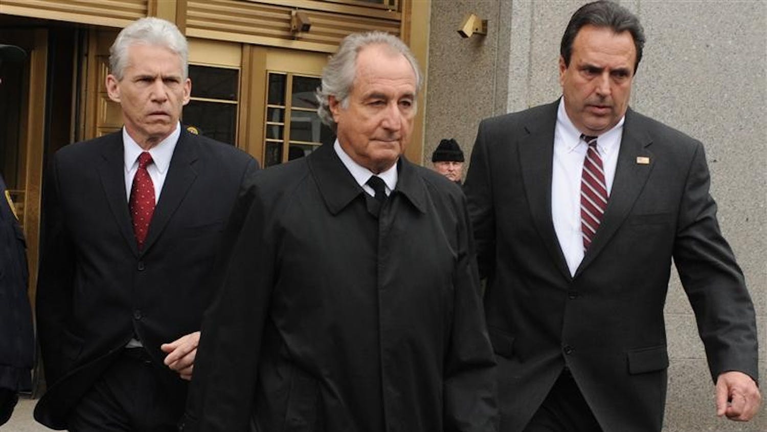Bernard Madoff exits Manhattan federal court Tuesday in New York. Bernard Madoff will plead guilty Thursday to 11 criminal counts including money laundering, perjury and securities, mail and wire fraud and will do so without a plea deal, knowing it carries a potential prison term of 150 years, lawyers said Tuesday in court. (AP Photo/ Louis Lanzano)