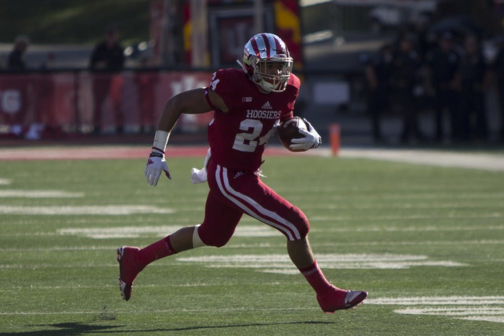 Running back Mike Majette runs the ball down the field during the first half of the game against Rutgers at Memorial Stadium on Saturday. IU trailed 27-24 at the half. 