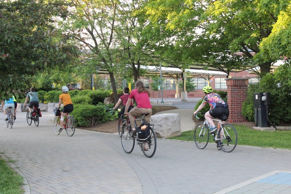 <p>Cyclists ride from Bloomington Community Bike Project to Upland Brewing Co. May 24, 2019. The Bicycle and Pedestrian Commission is in the midst of a project to add traffic calming devices like speed humps, curb bump-outs and speed cushions to Hawthorne and Weatherstone streets.</p>