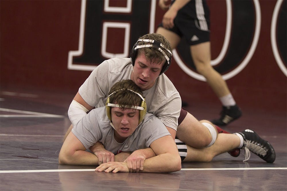 Members of the IU wrestling team practice pins and escapes during a practice on Wednesday afternoon. The team will open their season this Saturday at the Eastern Michigan Open.