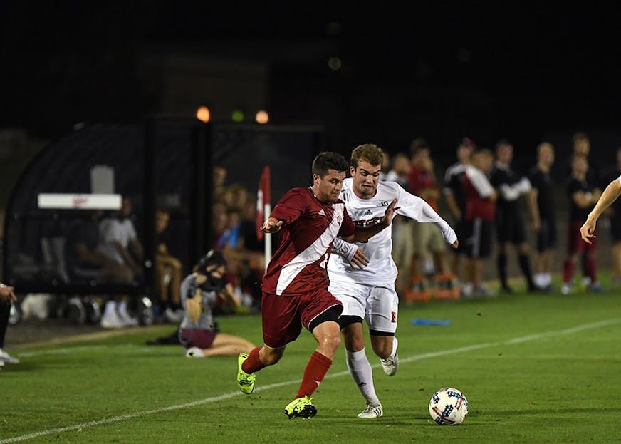 Junior midfielder Austin Panchot dribbles the ball against Rutgers Friday evening at Bill Armstrong Stadium. Panchot scored one goal to help IU to a 5-0 victory over Rutgers.