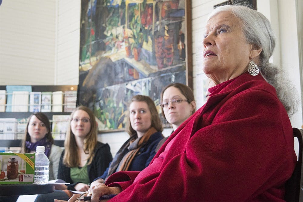 Constanc Luttinen and community members study herbal tea remedies with instructor Kris Heeter Saturday afternoon at the Hinkle-Garton Farmstead.