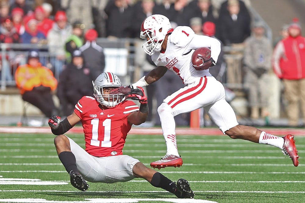 IU receiver Shane Wynn gets past a defender in a game against Ohio State on Saturday. Wynn had seven catches for 93 yards in a 42-27 loss at Ohio Stadium.