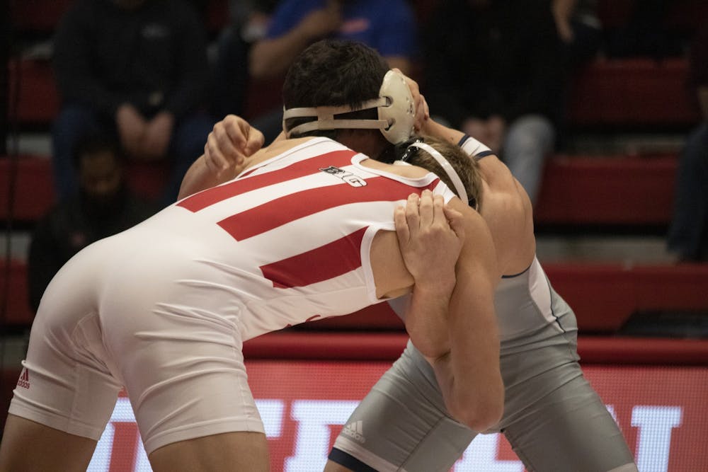 Redshirt freshman Kyle Lugis wrestles University of Tennessee Chattanooga junior Chris Debien on Feb. 24 in Wilkinson Hall. IU wrestling sent competitors to two separate tournaments last weekend.