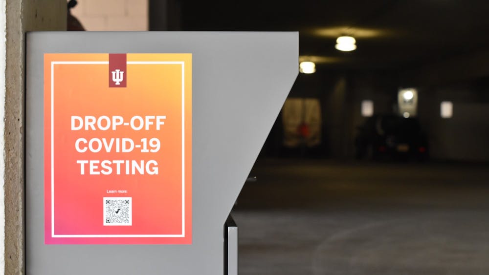 A COVID-19 drop-off box is pictured Feb. 15, 2022, the box is located in the East Garage. Test kits are available on campus at drop-off locations.