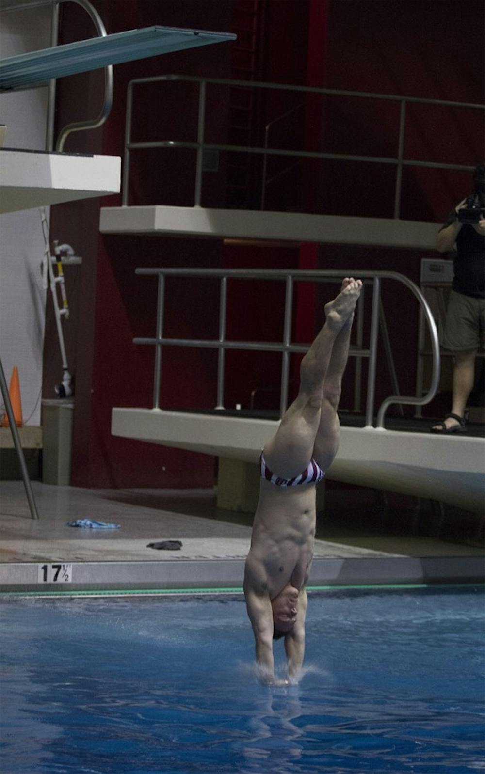 Diver Joshua Arndt goes into his fifth dive of the three-meter competition on Friday at Counsilman Billingsley Aquatic Center. Arndt competed with Cody Coldren and nine other divers in the quad meet.