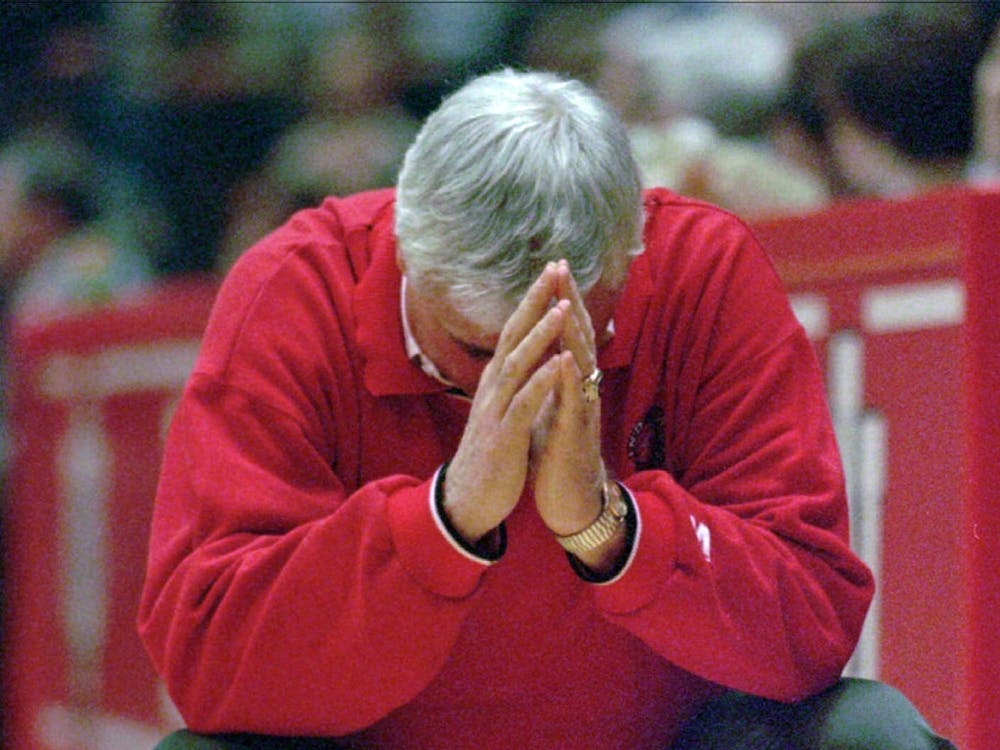 Former IU coach Bobby Knight crouches down in frustration during a game Feb. 2, 1997, in Bloomington. Knight was head coach of the men&#x27;s basketball team from 1971-2000.
