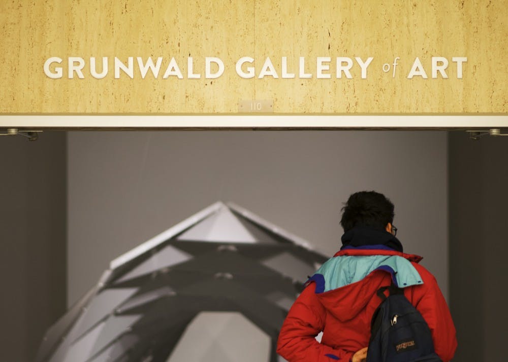 Then-junior Nicolas Martinez enters the Grunwald Gallery of Art, a gallery on the second floor of the Fine Arts Building that features art by professionals and students.&nbsp;