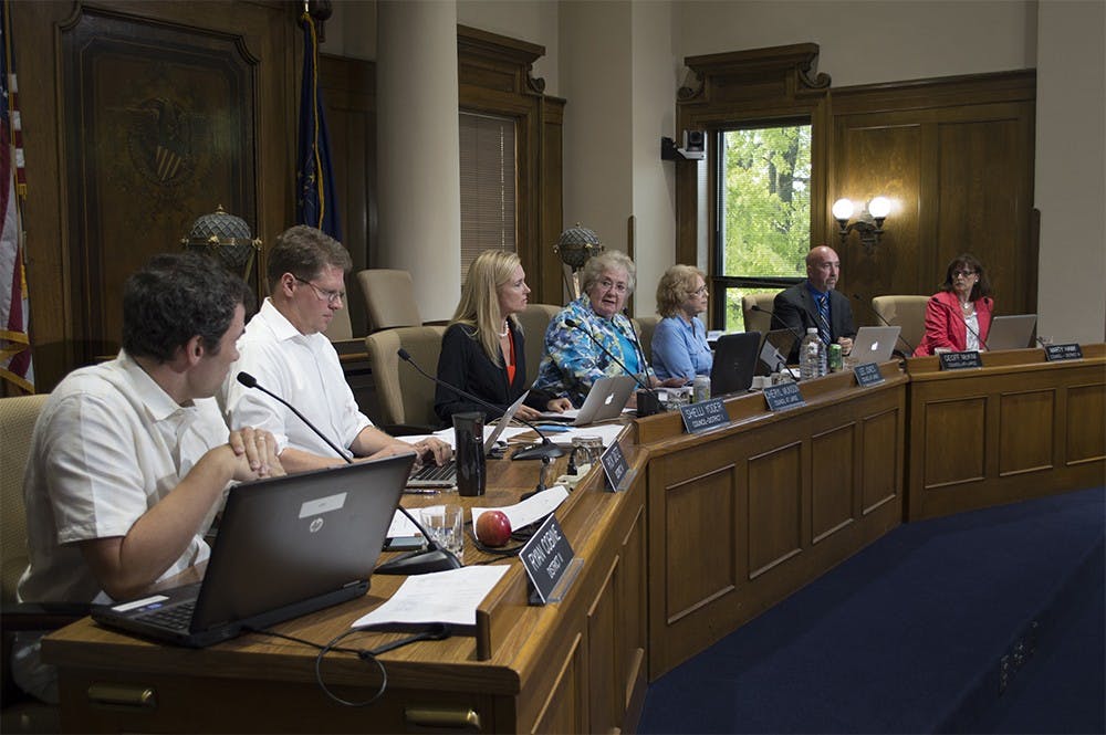 City council members discuss the meeting agenda on Tuesday. 