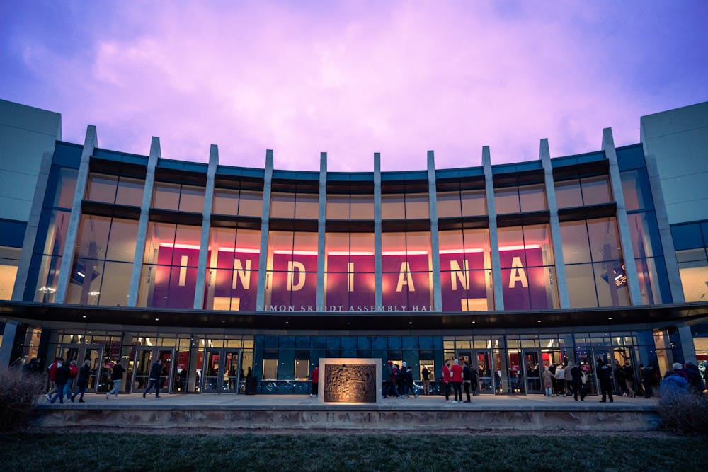 Blue hour sets in as fans enter Simon Skjodt Assembly Hall. Indiana will host Harvard in the 2023-24 season.