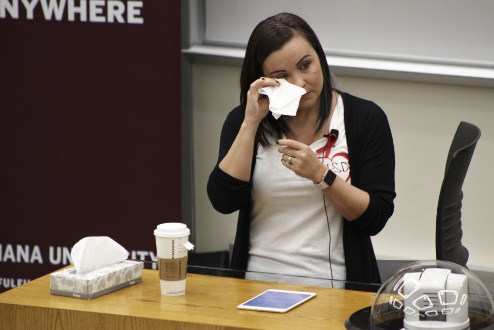 <p>Katherine Posada, an IU alumna and a language arts teacher at Marjory Stoneman Douglas High School in Parkland, Florida, wipes her eyes while speaking to future educators on Friday in the School of Education. Posada talked about her experience in her school with the Feb. 14 shooting and the roles teachers have in stopping tragedies like this from happening.</p>