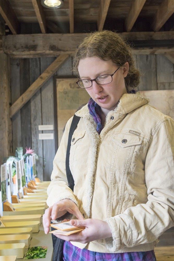 Rachel Hendrickson buys seed during the Heirloom Seed Sales event  Saturday afternoon at the Wylie house.