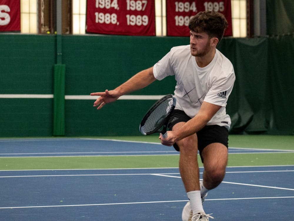 Junior Zac Brodney reaches for a volley Jan. 13 at the IU Tennis Center. Brodney was honored this week for having the highest team GPA.&nbsp;