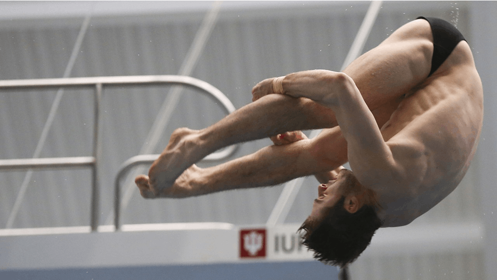 Then-junior Michael Hixon performs a back 2.5 somersault pike at the 2017 NCAA Swimming and Diving Championships. Junior Brendan Burns and freshman diver Carson Tyler each earned their second Big Ten weekly award.