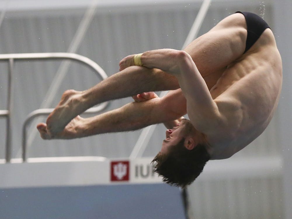 Then-junior Michael Hixon performs a back 2.5 somersault pike at the 2017 NCAA Swimming and Diving Championships. Junior Brendan Burns and freshman diver Carson Tyler each earned their second Big Ten weekly award.