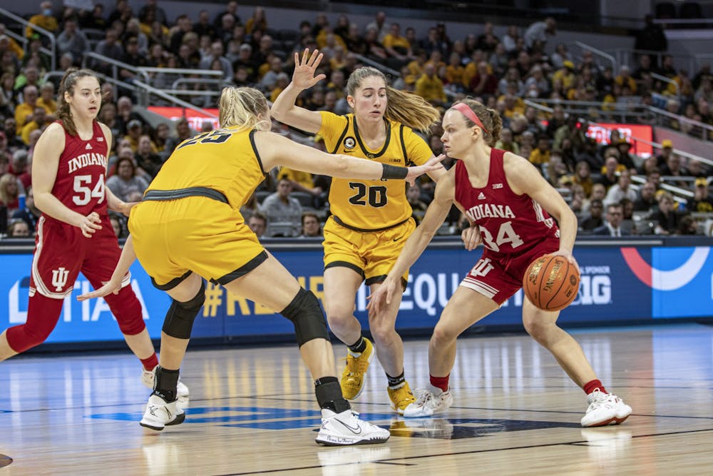 <p>Then-senior guard Grace Berger attempts to dribble out of a double team in the Big Ten Tournament Championship on March 6, 2022, at Gainbridge Fieldhouse. Berger and No. 2 Indiana women&#x27;s basketball hosts No. 5 Iowa in Bloomington on Thursday.</p>