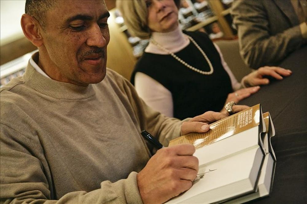 Former Indianapolis Colts head coach Tony Dungy signs copies of his new book "Uncommon," Thursday afternoon in the IU Bookstore. Dungy recently retired from his coaching position with the Colts, who won the Superbowl in 2007, making Dungy the first African-American coach to win the Superbowl.