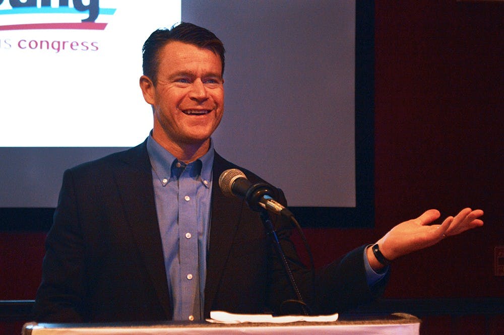 Republican candidate Todd Young announces his victory in the election Tuesday at his watch party at Macri's at The Depot.
