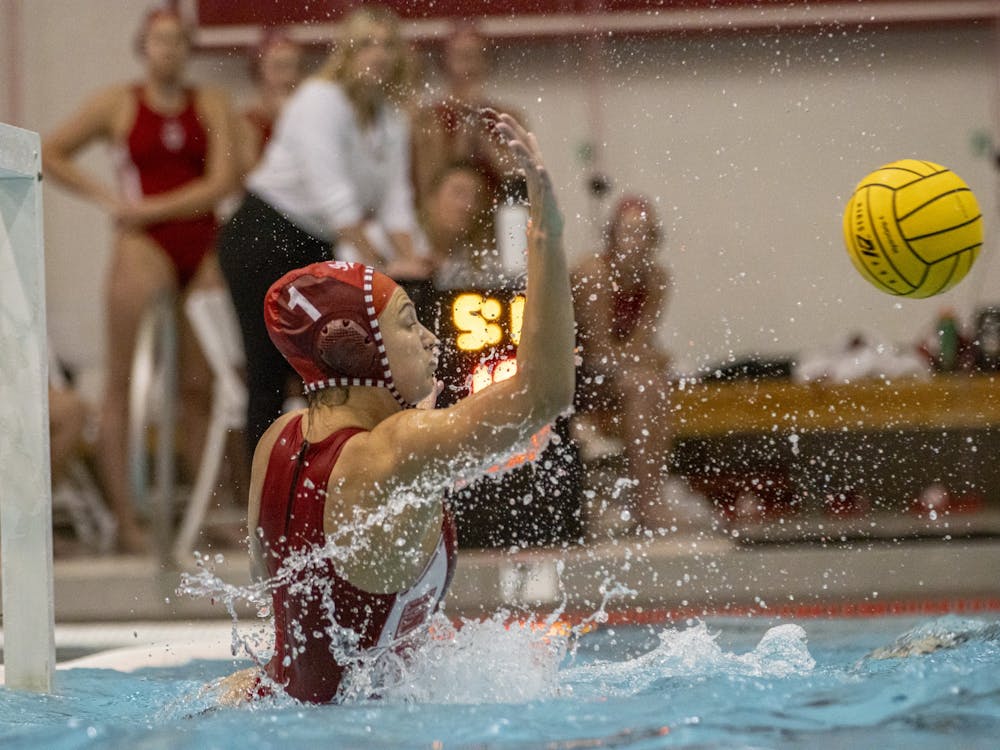 Senior goalkeeper Mary Askew rises to block a shot during the match against the University of California, Berkeley  on March 21, 2022, at the Counsilman-Billingsley Aquatic Center. Indiana fell in its home opener 15-5.