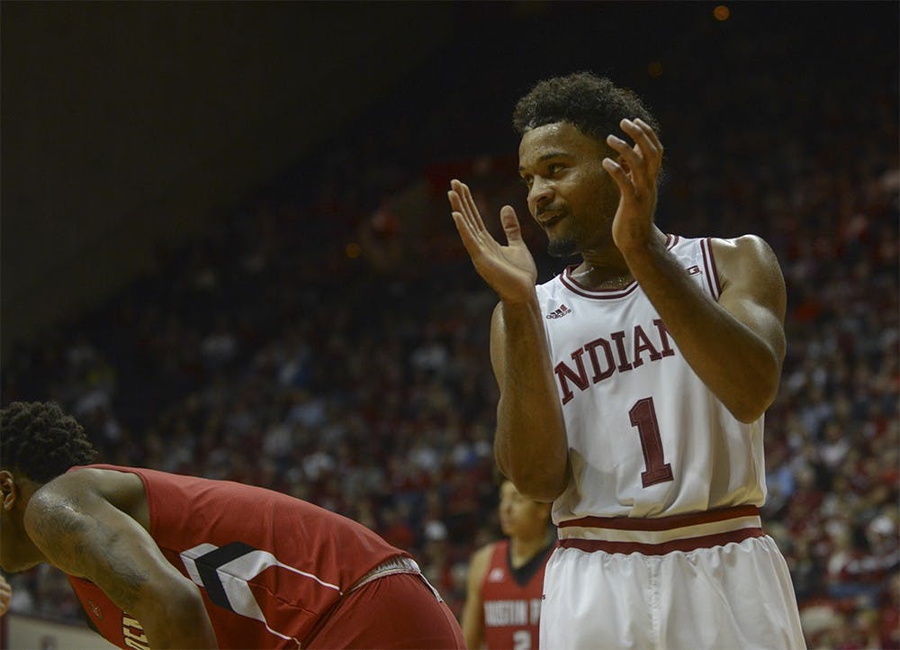 Sophomore guard James Blackmon Jr. claps after Kevin "Yogi" Ferrell dove for the ball during the game against Austin Peay on Monday at Assembly Hall. The Hoosiers defeated the Governors 102-76.