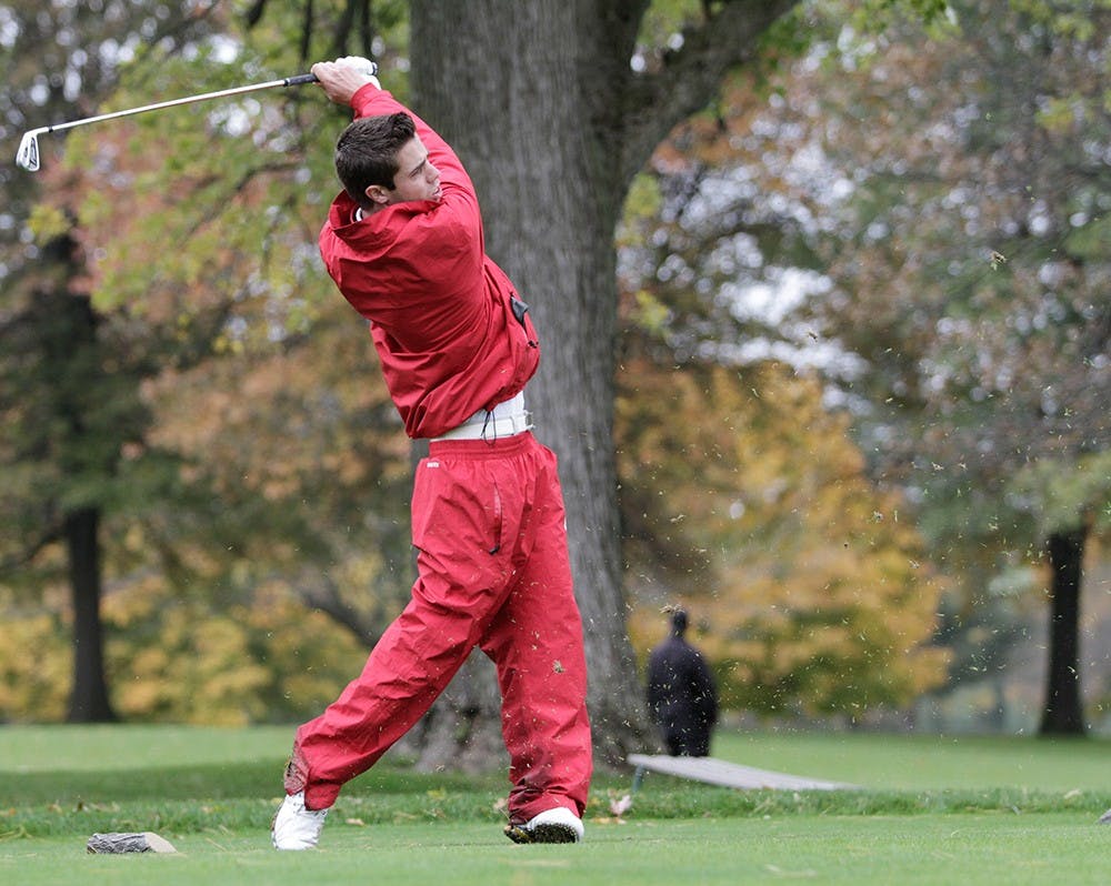 Max Kollin tracks the flight of his tee shot on the par-3 eighth hole at the Delaware Country Club during the Earl Yestingsmeier Invitational on Nov. 15, 2012.