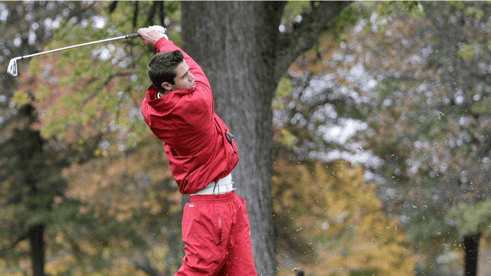 Max Kollin tracks the flight of his tee shot on the par-3 eighth hole at the Delaware Country Club during the Earl Yestingsmeier Invitational on Nov. 15, 2012.
