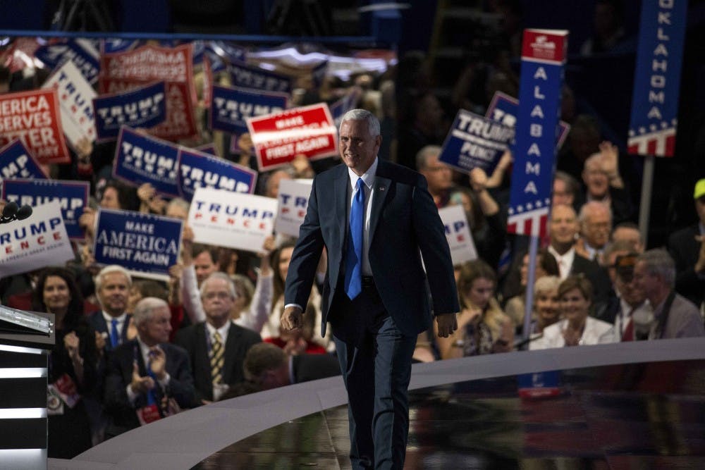 Governor Mike Pence walks onto stage at the Republican National Convention on July 20 at the Quicken Loans Arena in Cleveland, Ohio.