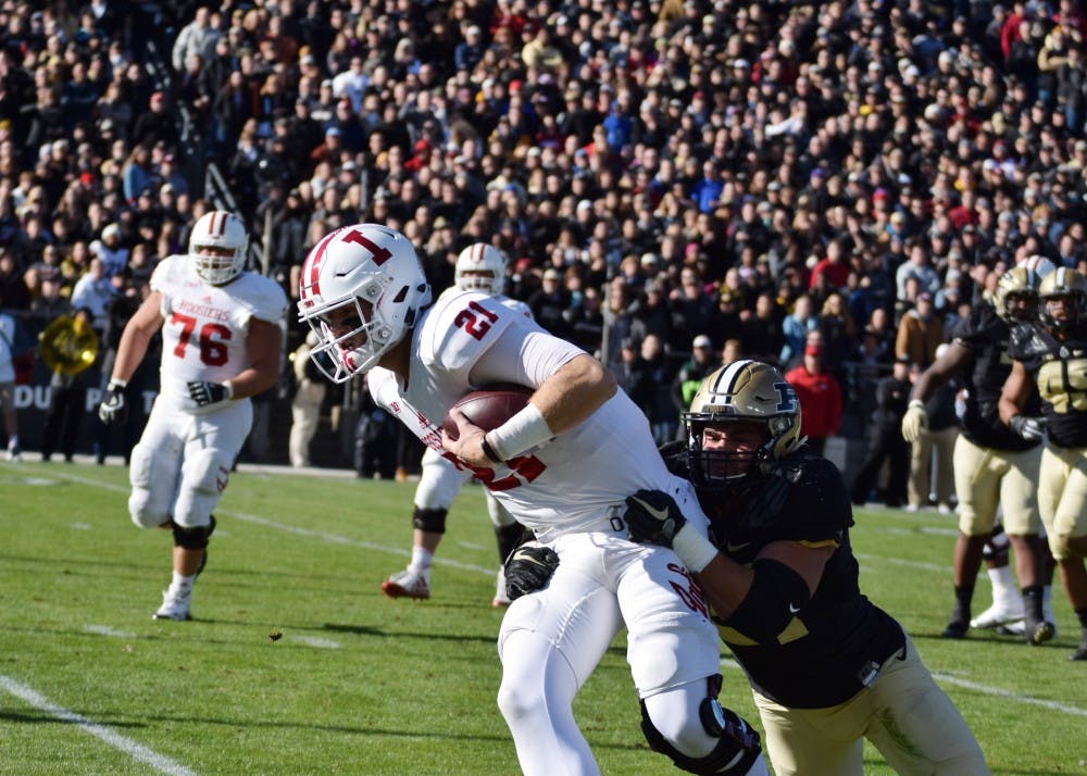 Senior quarterback Richard Lagow attempts to run the ball but falls short at the Old Oaken Bucket game Saturday in West Lafayette, Indiana. IU lost to Purdue, 31-24.