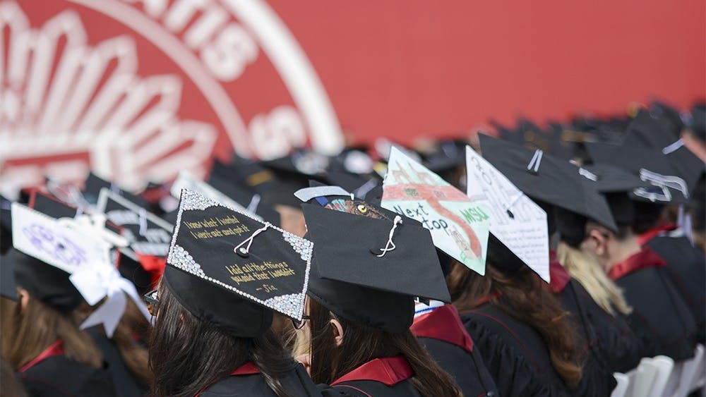 Graduates wear DIY graudation cap during Spring 2016 Undergraduate Commencement Ceremony on Saturday morning at Memorial Stadium. 