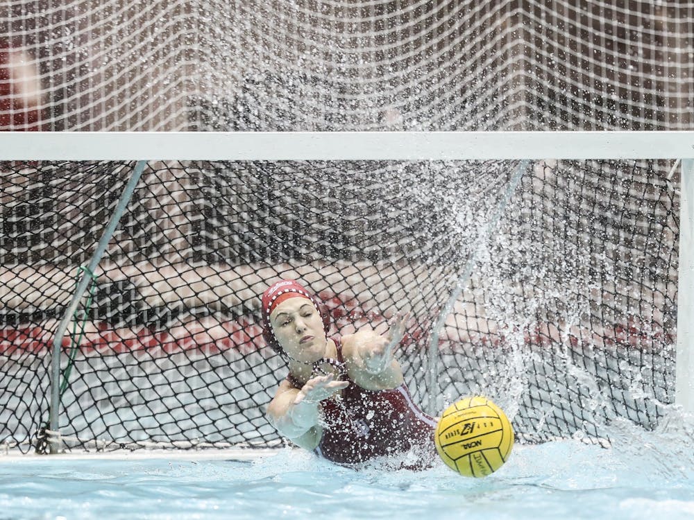 Then-junior goalkeeper Mary Askew blocks a shot Jan. 25, 2020, at the Counsilman-Billingsley Aquatics Center. Indiana will face four different teams in Ann Arbor, Michigan over the weekend.