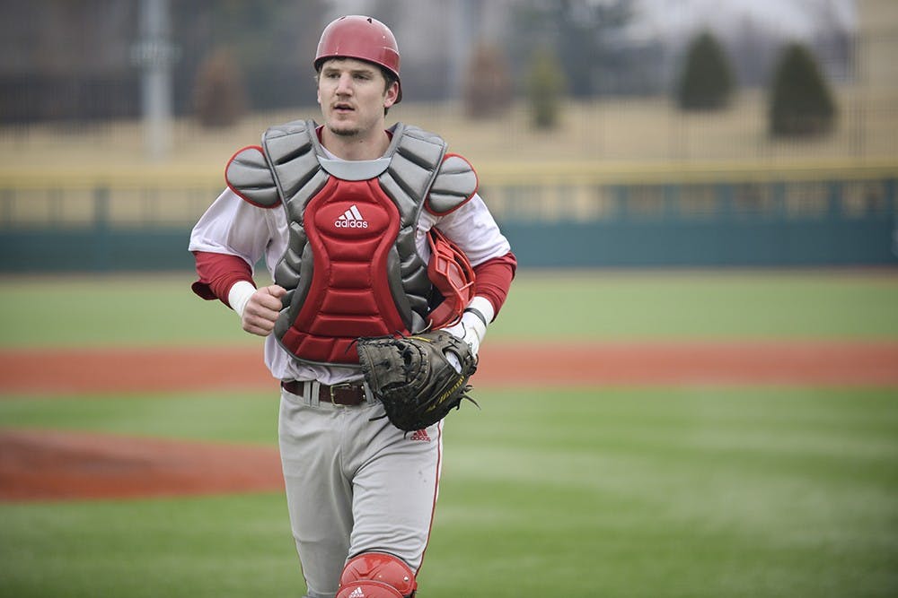 Senior Brad Hartong walks off the field during the Hoosiers' scrimmage on Saturday at Bart Kaufman Field. Hartong will be the starting catcher this season, replacing Kyle Schwarber who was drafted fourth in the first round of the 2014 MLB First-Year Player Draft.