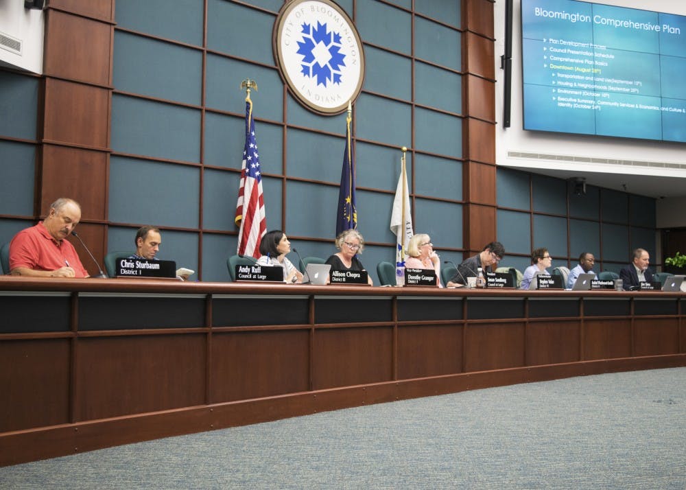 Bloomington City Council members listen to a presentation at a September meeting. The council voted unanimously to pass a proposal to fund five cameras for the downtown Bloomington area Wednesday night.