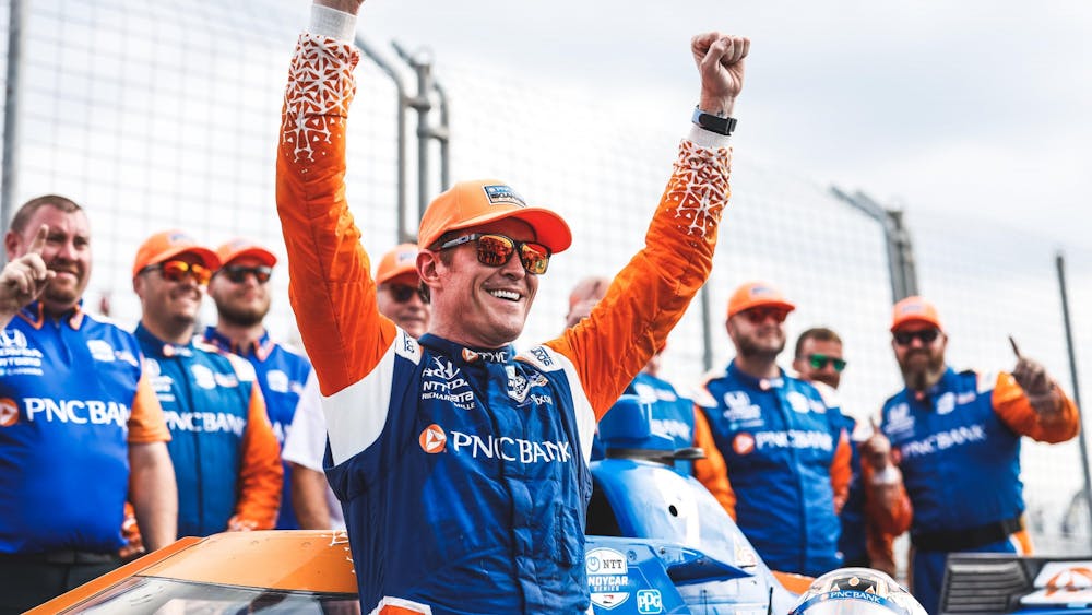 Scott Dixon, the winner of the Honda Indy Toronto race, cheers with his crew July 17, 2022, in Toronto, Ontario, Canada. After winning Sunday&#x27;s race, Dixon is now tied Mario Andretti for the second-most wins of all time with 52 wins, while A.J. Foyt remains in first with 67 wins.