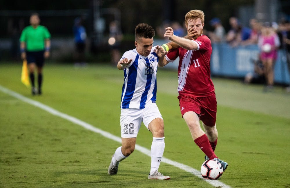 <p>IU senior midfielder Cory Thomas takes a hand to the face from senior Kentucky defender Tanner Hummel on Oct. 3 during a game at the Wendell &amp; Vickie Bell Soccer Complex. The Hoosiers broke their winning streak, falling 3-0.</p>