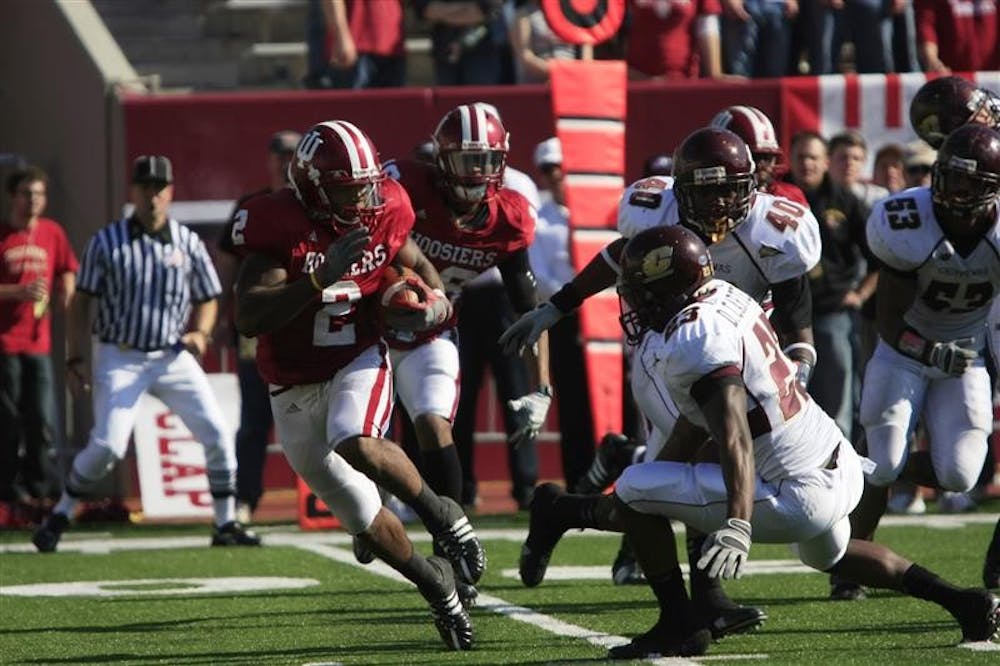 Senior running back Marcus Thigpen evades Central Michigan defenders during a game Nov. 1 at Memorial Stadium. IU lost 37-34.