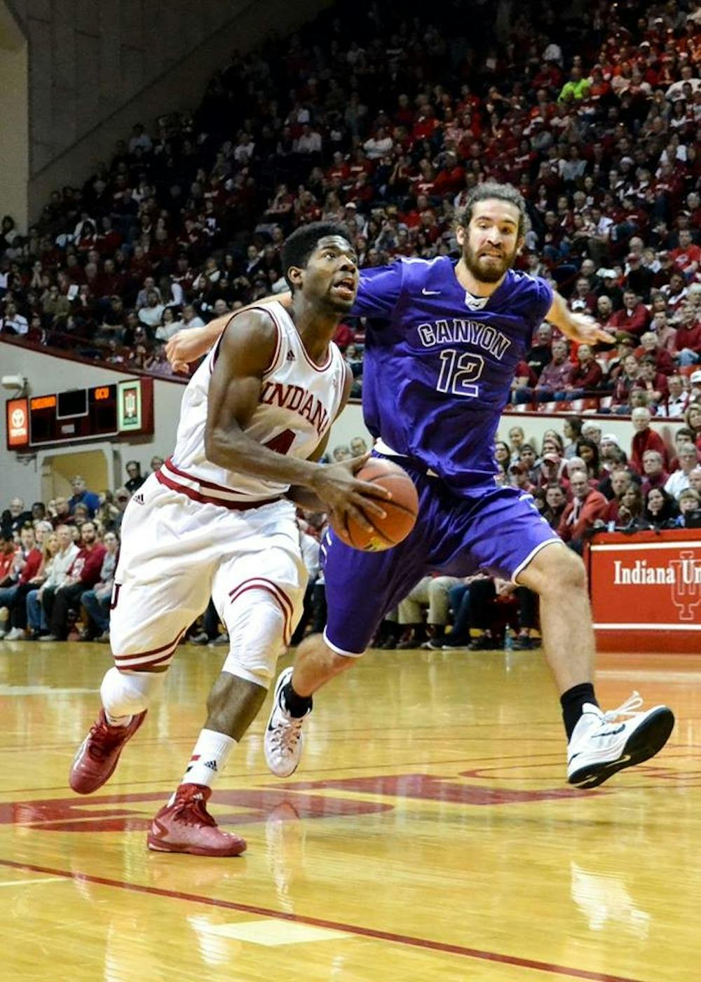 <p>Freshman guard Robert Johnson looks for the basket during Saturday's game against Grand Canyon University at Assembly Hall.</p>
