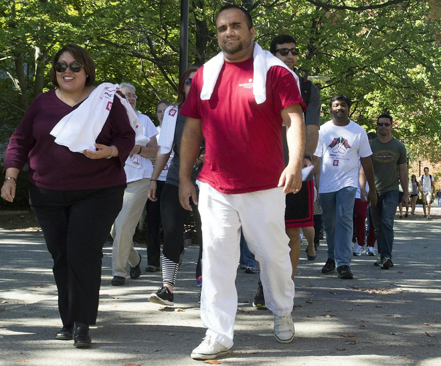 Nelda Montemayor and Mazias de Oliveira walk to Sholwalter Fountain to finish their one mile walk in observance of World Heart Day in recognition of the high rates of heart disease related deaths in Indiana. "Coming out here and seeing everyone wanting to be healthy, I think that's a motivator," Montemayor said.