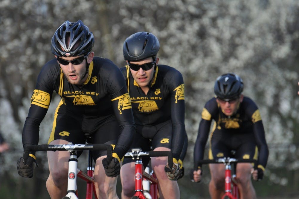 <p>Cyclists from Black Key Bulls ride during the Team Pursuit event on Sunday at Bill Armstrong Stadium. Black Key Bulls finished first in the event.</p>