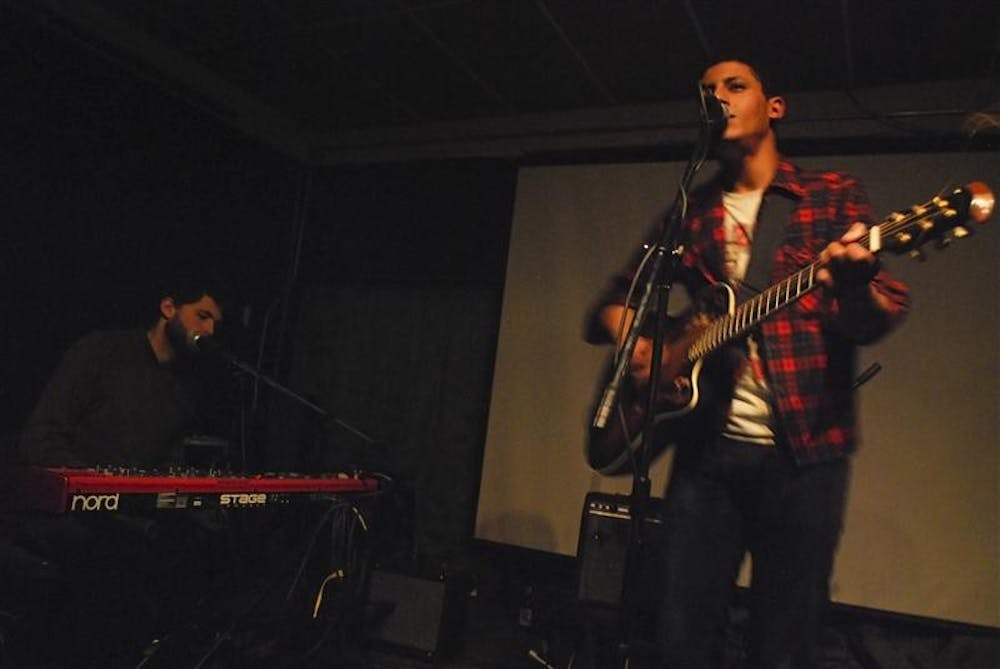 Keyboardist David Morrin and singer Miles Benjamin Anthony Robinson play Saturday evening at The Cinemat. Morrin and Robinson performed a set full of dirges and lamentation. 