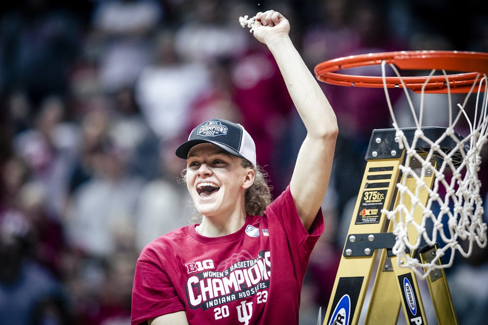 <p>Senior guard Grace Berger celebrates after cutting the net Feb. 19, 2023 at Simon Skjodt Assembly Hall in Bloomington, Indiana. Indiana Athletics announced Wednesday there is high demand for reserved season tickets for the 2023-2024 women&#x27;s basketball season. </p>