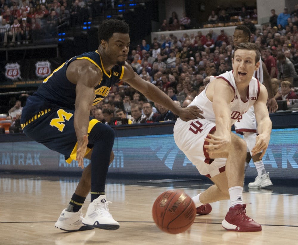 Freshman guard Harrison Niego passes the ball during the Big Ten Tournament game against Michigan on Friday at Bankers Life Fieldhouse. The Hoosiers lost 72-69.