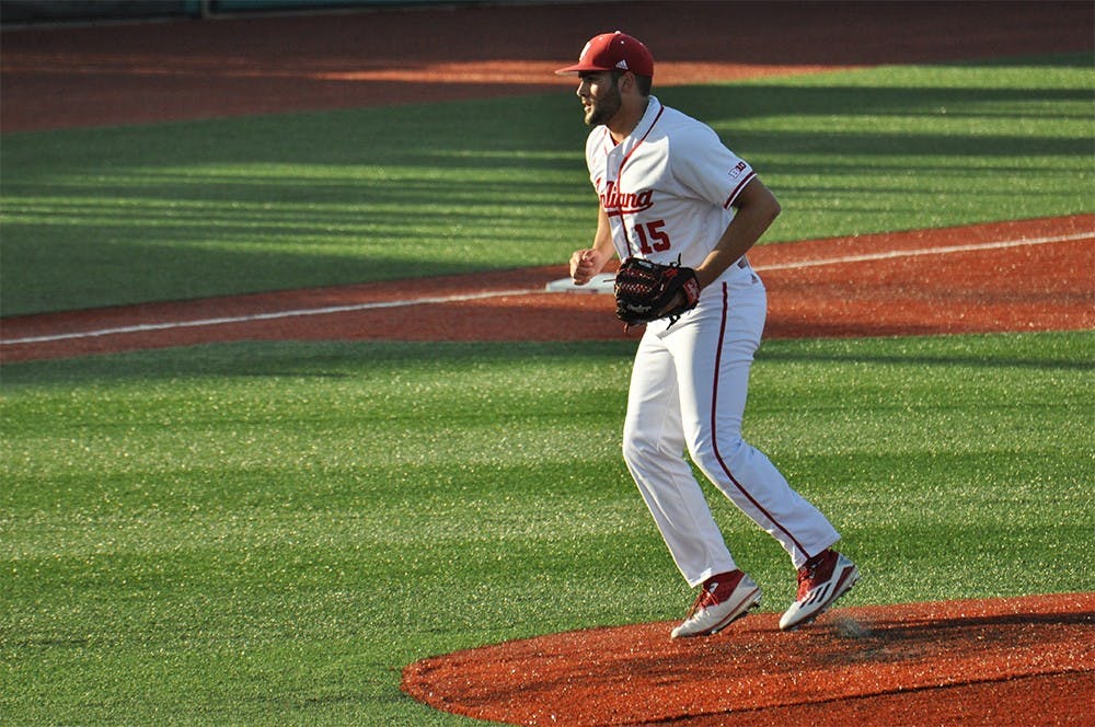 Freshman pitcher Paul Milto jumps off the mound after striking out a Cincinnati player during Tuesday's 5-0 loss to Cincinnati. 
