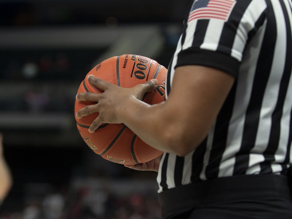 A referee holds a basketball March 6 at Bankers Life Fieldhouse in Indianapolis. The Big Ten tournament will continue as scheduled despite concerns over the coronavirus outbreak. 