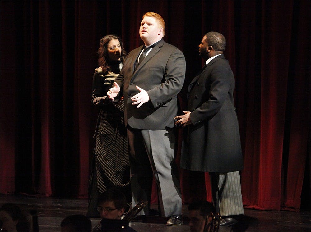 (From left) Marianthi Hatzis, Tislam Swift, and Connor Martin Lidell sing during a dress rehearsal for New Voices Opera on Thursday.  The organization is performing "The King in Yellow" and "THUMP!" on Friday at the Buskirk-Chumley Theater.