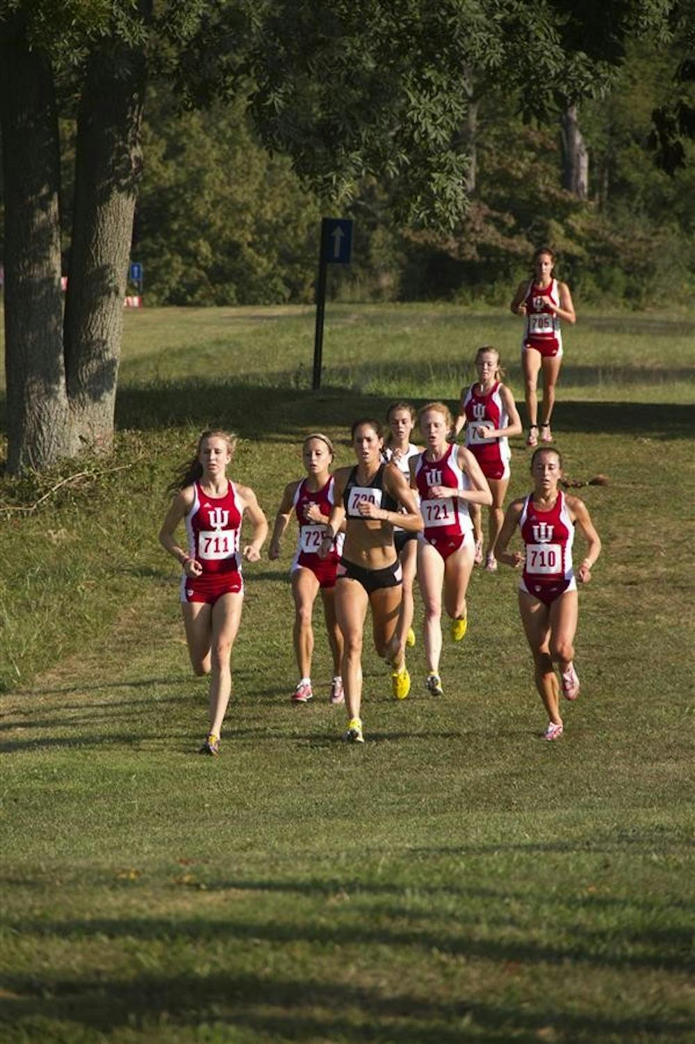 The front pack of the women's race runs toward the 4-kilometer marker in the 5-kilometer race during the IU Open on Saturday morning at IU Cross Country Course.