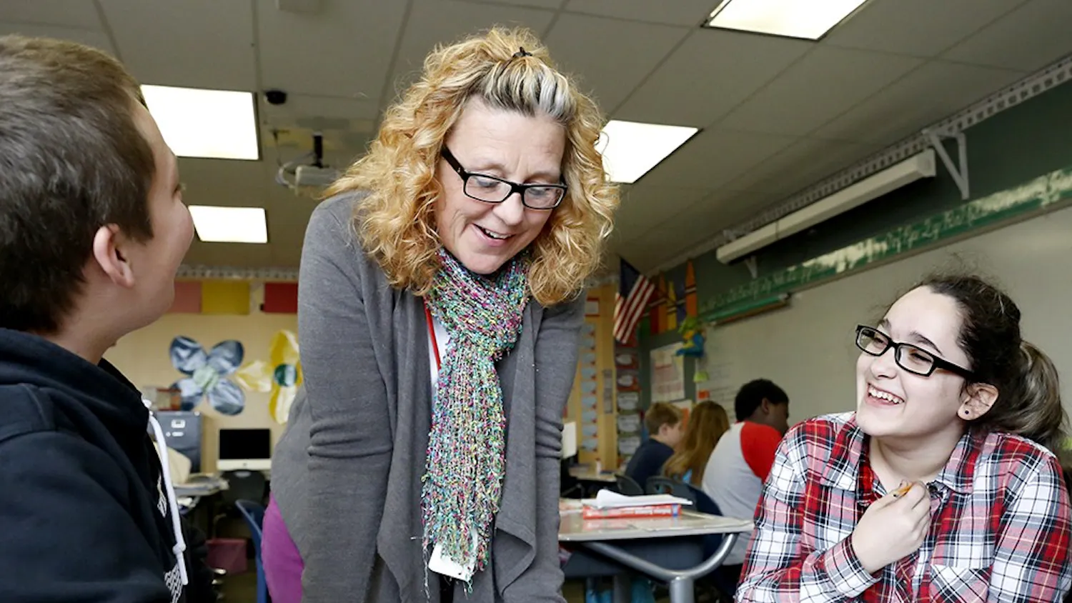 Julie Bryant, center, helps Cole Chambers, left, and Amber Hoene during a reading class Thursday at Fairview Elementary School. Fairview received F ratings for three consecutive years, but the school earned a C rating last year's ISTEP testing.