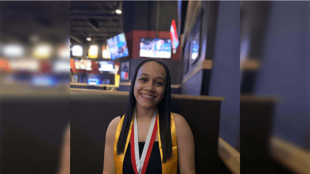 Then-high school senior Ana Allen poses for a picture wearing a medal for mainting academic excellence through her high school years on May, 28, 2021. Now an IU freshman, Ana Allen is a first generation African American student.
