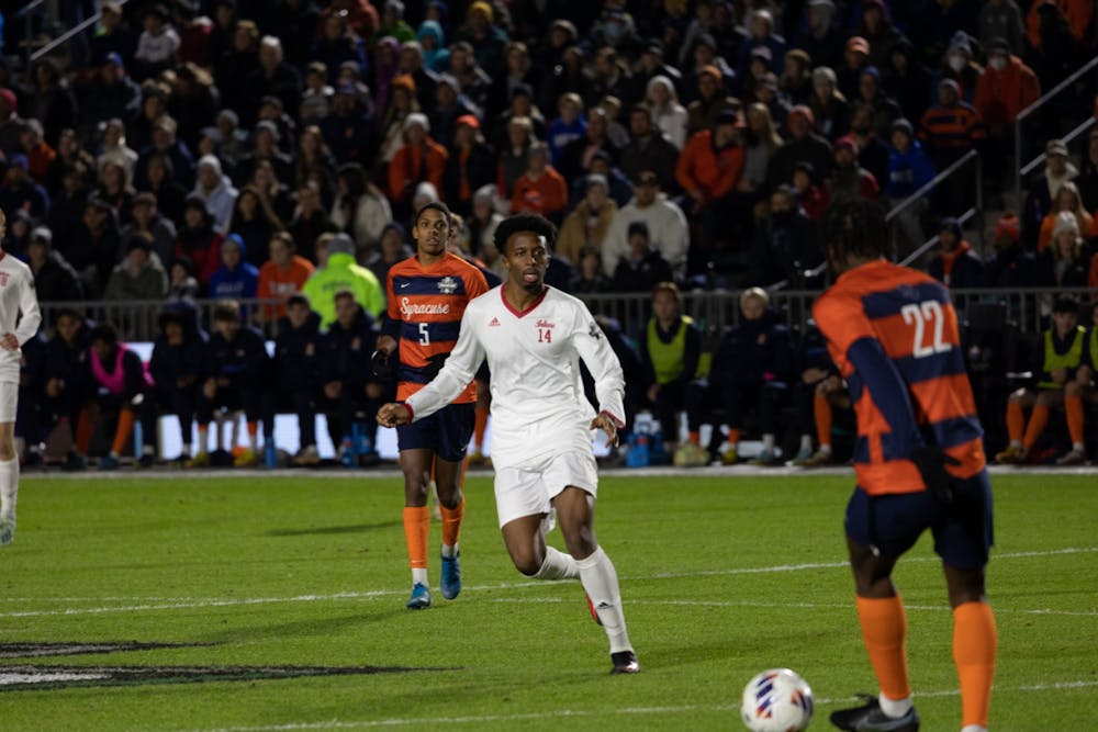 <p>Indiana senior forward Maouloune Goumballe defends against Syracuse University in the men&#x27;s soccer national championship on Dec. 12 in Cary, North Carolina. The Hoosiers lost the College Cup final in penalty kicks.</p>
