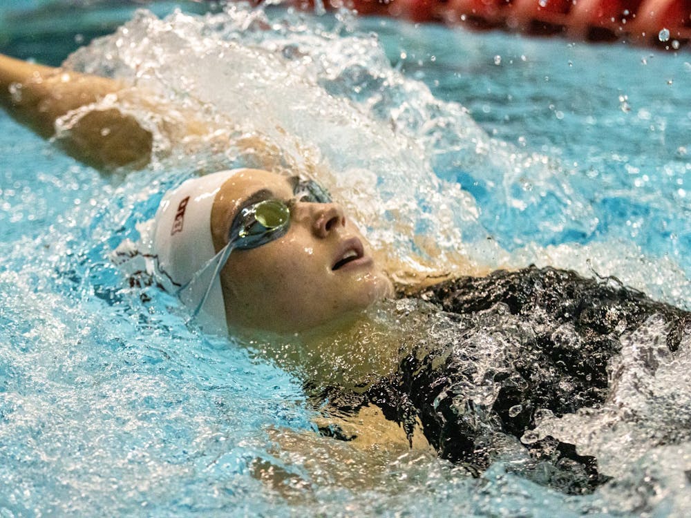 An Indiana swimmer competes in a backstroke race during a duel meet against University of Cincinnati on Dec. 3, 2021, in the Counsilman-Billingsley Aquatic Center. Indiana women&#x27;s swimming and diving finished the fall season with a 5-1 record.